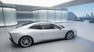 Sleek white futuristic electric sports car with minimalist design in a modern, well-lit architectural setting with city skyline.